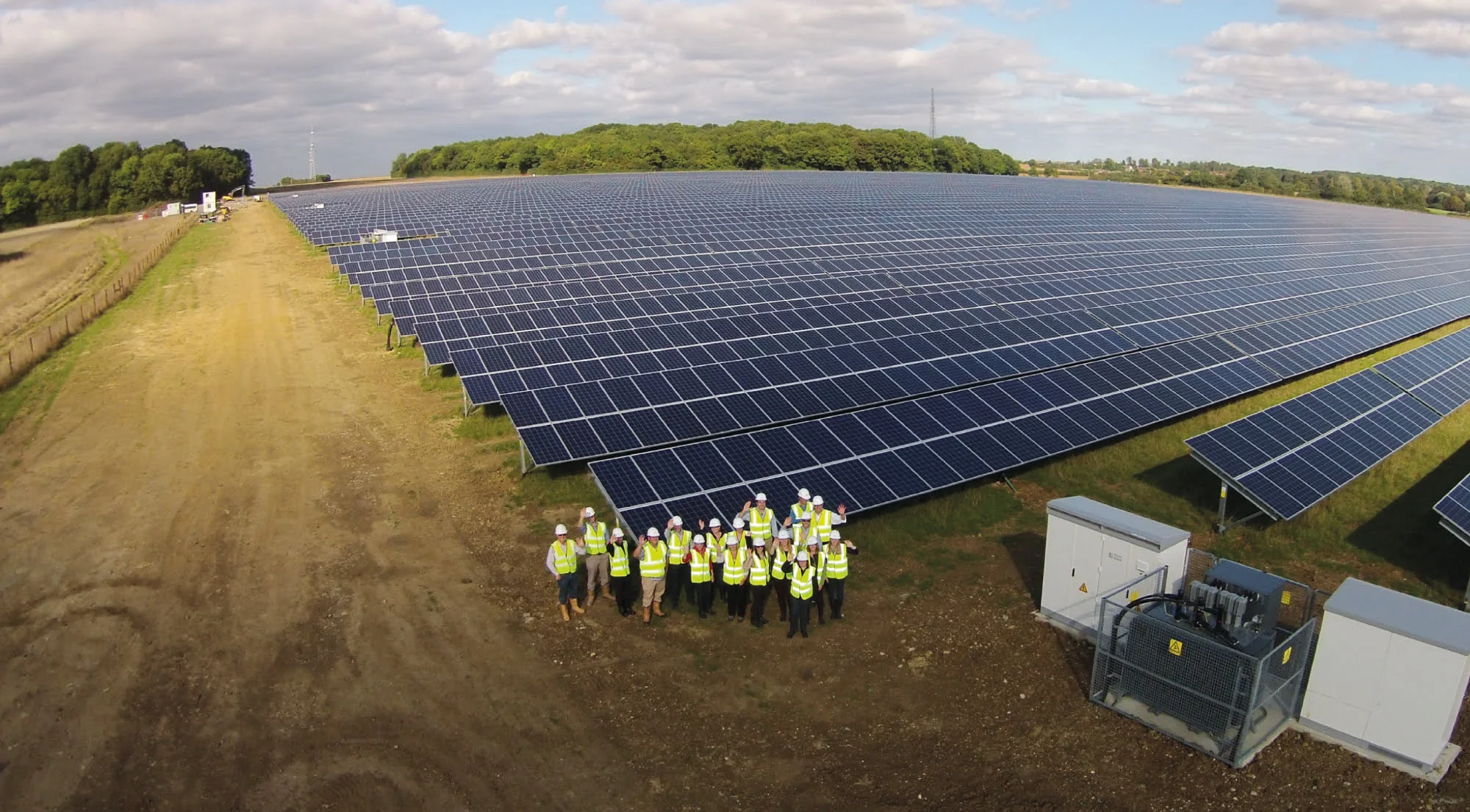 efws PROINSO's constructors and solar panels on a field